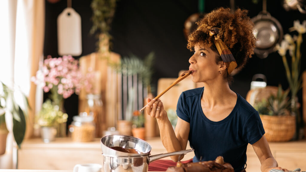 Woman sampling banana bread batter